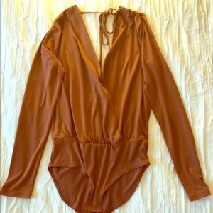 BCBG V-neck bodysuit. Color: caramel. NEVER WORN.
